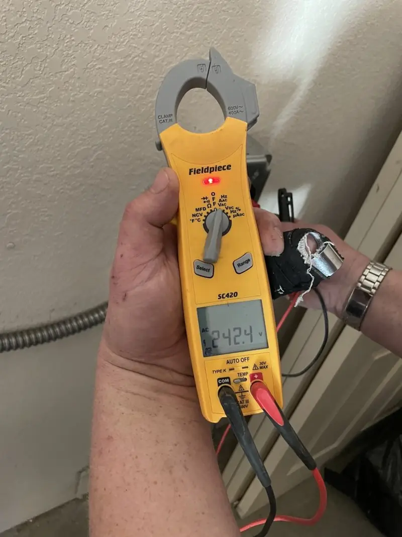Voltage testing with clamp meter during Recessed Lighting Installation in Folcroft